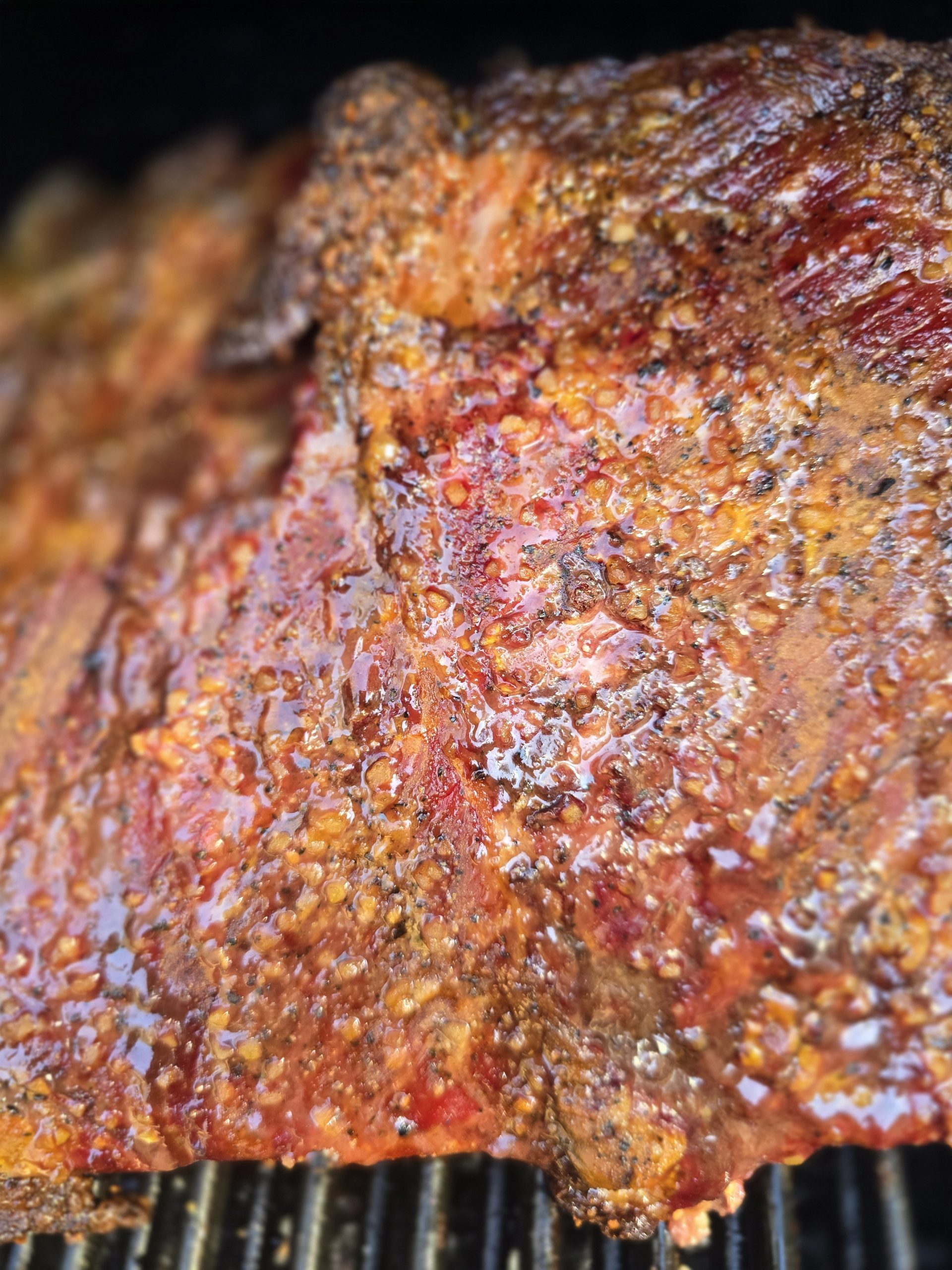Image of brisket on th e grill