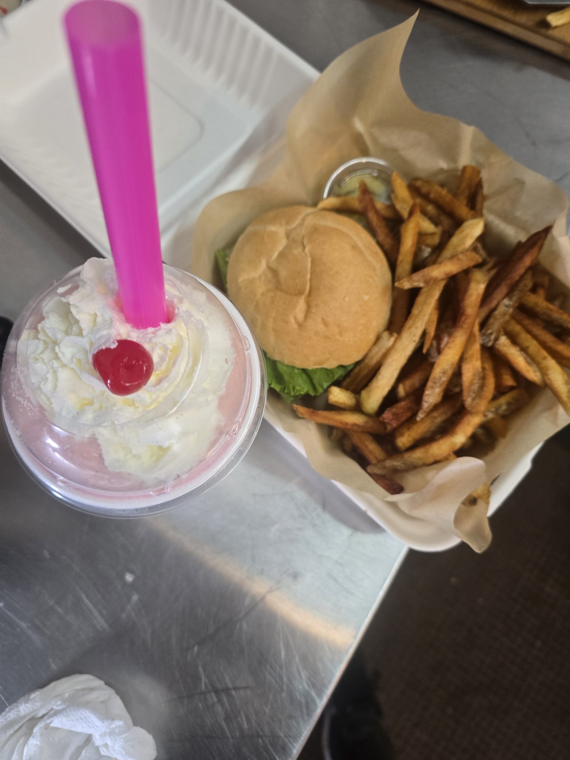 Smashburger with fries and a shake