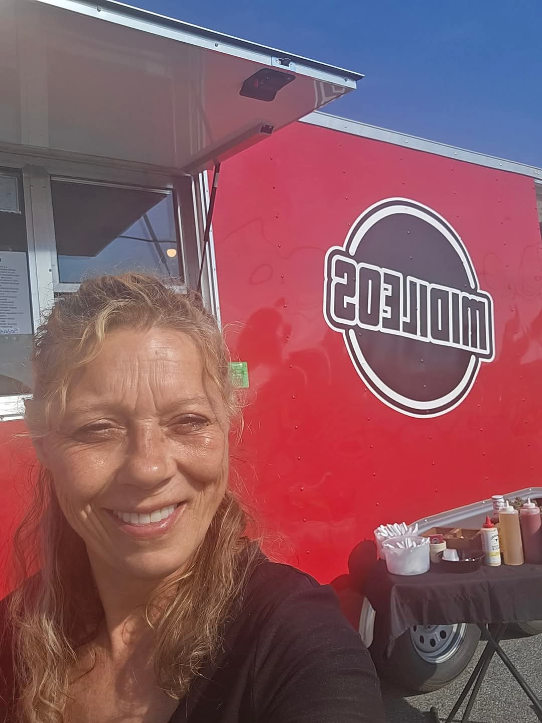 Picture of founder, Michelle, in front of the now famous truck